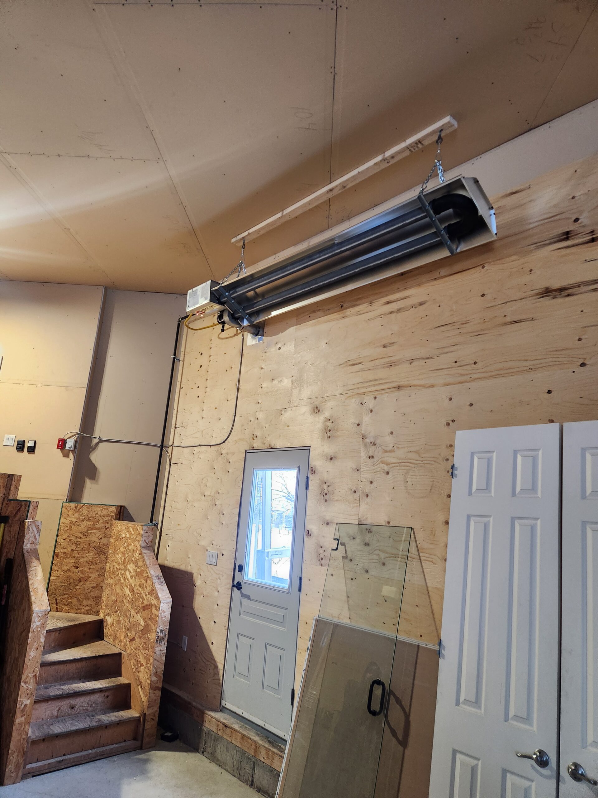 Overhead heater installation by ER Plumbing & Heating