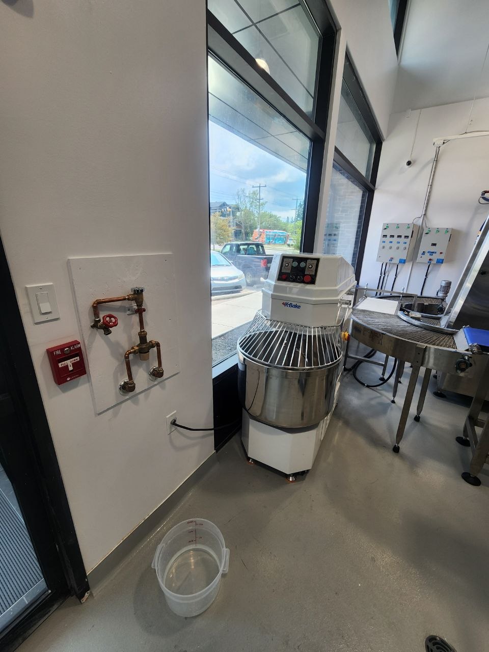 Commercial dough mixer and bakery production equipment in a Calgary bakery