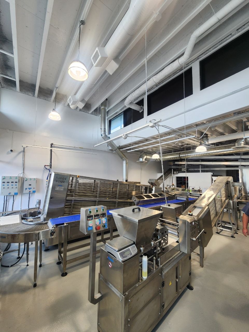 Commercial bakery production equipment and ventilation in a Calgary food-service space